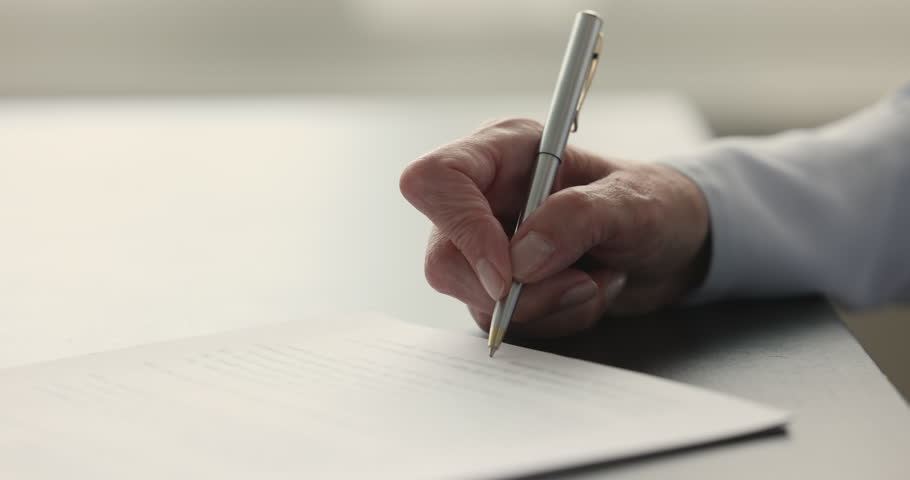 Hand of mature woman affixing signature to legal document, signing insurance medical agreement, business contract, investing to real estate property. Close up cropped shot Royalty-Free Stock Footage #1106785659