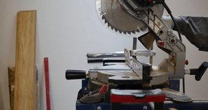 Professional worker cutting wood with circular saw. High-quality videos of wood cutting in renovation; Impressive footage of circular saw in action; Renovation scenes with electric circular saw