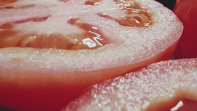 Fresh chopped tomatoes on a plate. Macro close up view. Harvesting tomatoes - Powered by Shutterstock - Get 15% off with code: PIKWIZARD15