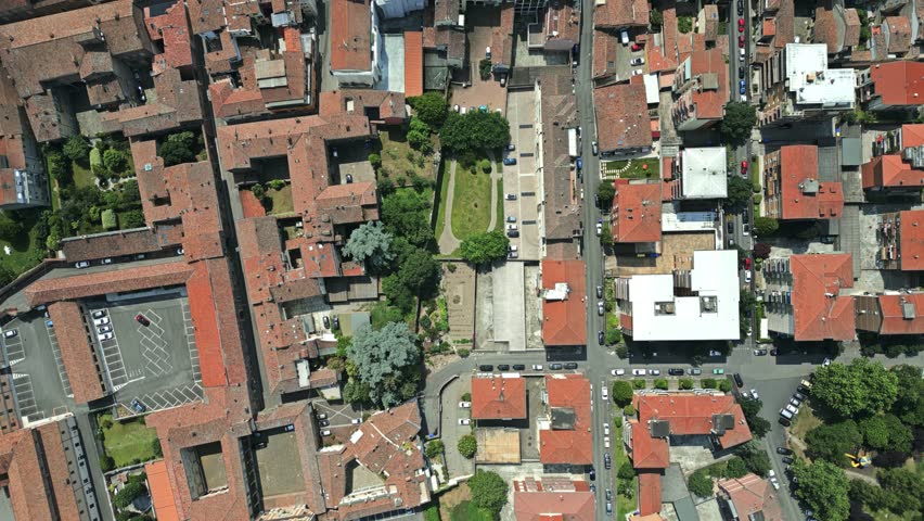 Roofs of old houses and streets in Piacenza, Italy. Overhead aerial drone view Royalty-Free Stock Footage #1106788781