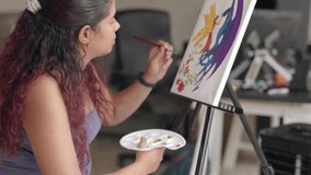 Painting artwork leisure at home. Enjoy weekend hobby. South american venezuelan mid woman close-up
