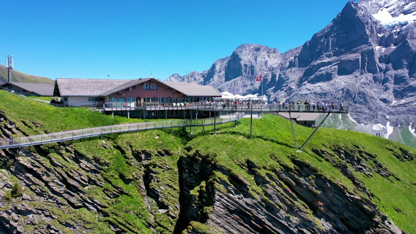 Tourists on one of the most stunning Viewing Station in Switzerland Alps