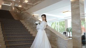 The bride is standing on a beautiful staircase - Powered by Shutterstock - Get 15% off with code: PIKWIZARD15