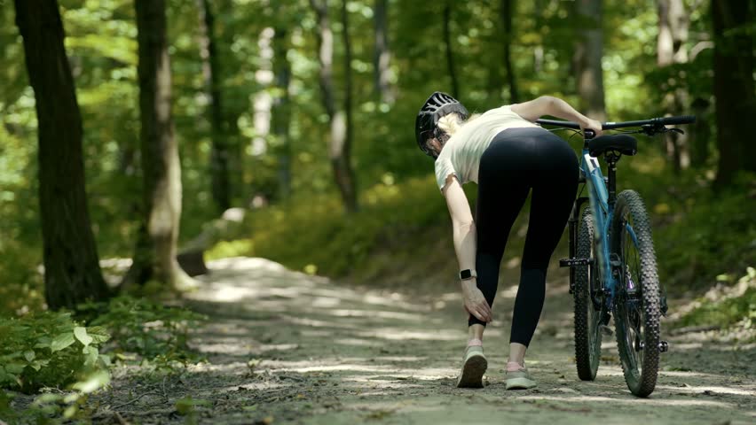 Cyclist Feeling Leg Pain On Exercising Joint Ligament Problem. Muscle Cramp On Leg.Cyclist Having Painful Knee Injury During Cycling Workout Exercise.Legs Trauma Massage Pain Sprain Severe Pain Spasm Royalty-Free Stock Footage #1106795475