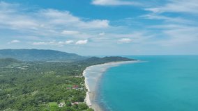 High quality video Bird's eye view Breathtaking aerial view dramatic mountains, blue ocean on samui island Thailand. Beautiful nature drone flying