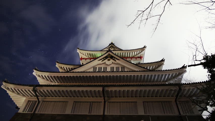 Astrophotography time lapse footage of night sky over historic Japanese Castle in Atami, Shizuoka, Japan