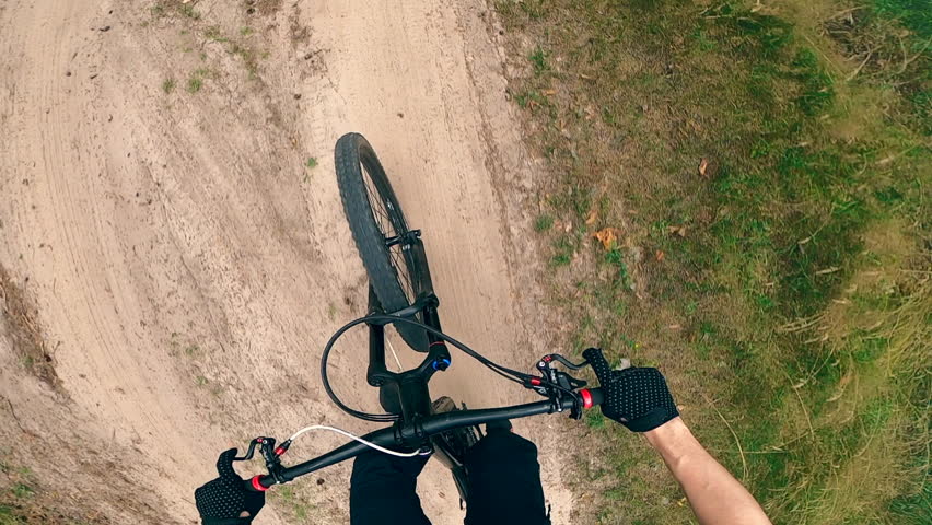 First-person view of a person riding a bmx along the trail