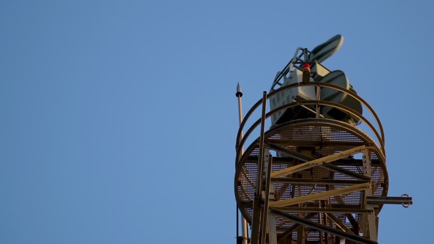 Military radar turning on a metal structure