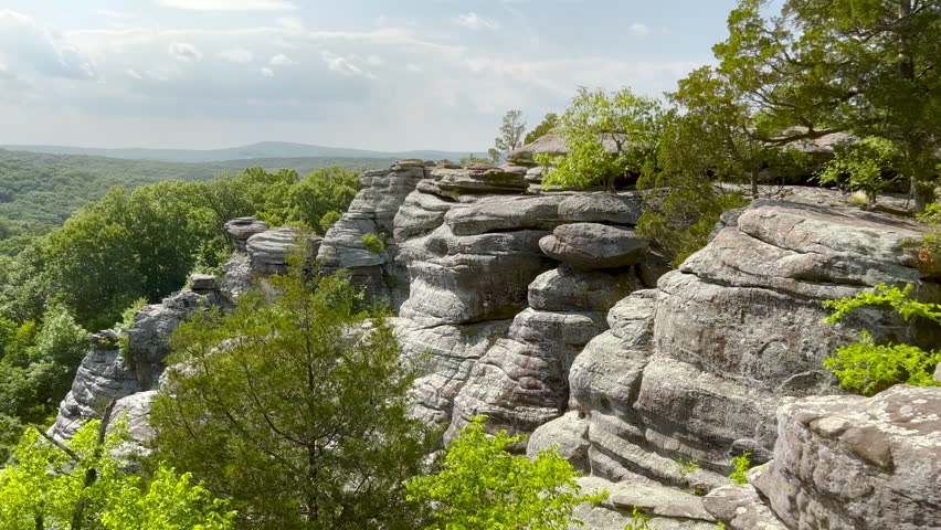 On top of the world at Garden of the Gods in Shawnee National Forest. Incredible views of the sandstone rock formations surrounded by a lush green forest. 