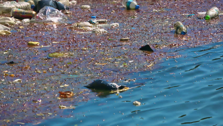 Water Pollution With Dirty And Plastic Garbage Floating On The Surface Of The Sea. Royalty-Free Stock Footage #1106817197