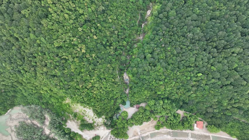 aerial view of waterfalls in forest, a Nature Video by murattellioglu