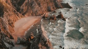 Aerial Drone footage of Praia da Ursa in Portugal during Sunset