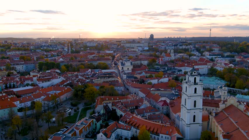 Beautiful aerial Vilnius city Old town panorama in autumn with orange and yellow foliage. Aerial evening view. Fall city scenery in Vilnius, Lithuania Royalty-Free Stock Footage #1106822275