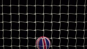 Frontal shot of United Kingdom Soccer Ball Scoring Goal during the day with transparent (alpha) background