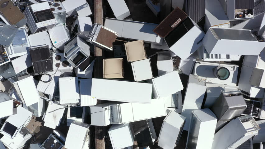 Aerial ascent above massive pile of white discarded appliances Royalty-Free Stock Footage #1106830663