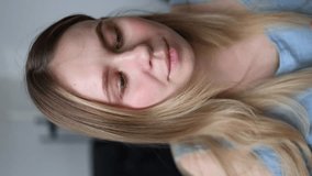 the girl looks in the mirror and paints her lips with her fingers and mascara. a woman looks at the camera and applies make-up to her lips. vertical video. getreadywithme grwm - Powered by Shutterstock - Get 15% off with code: PIKWIZARD15