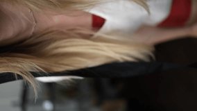 a girl in a straw hat and sunglasses poses for the camera and laughs. female smile with beautiful teeth. the girl takes off her glasses and laughs at the camera. vertical video - Powered by Shutterstock - Get 15% off with code: PIKWIZARD15