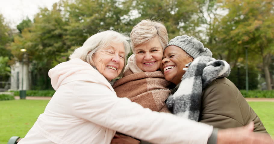 Senior, hug and relax with friends in park for retirement, happy and health. Elderly, happiness and social with portrait of old women in embrace in nature for wellness, smile and peace together Royalty-Free Stock Footage #1106838249