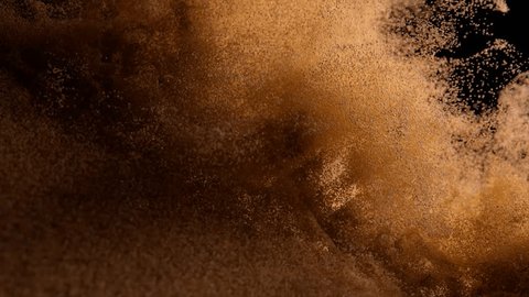 Bronze sand cover blown off on a black isolated background. Airflow. Grains of sand. Slow motion. 3d animation. 3D Illustration Arkivvideo