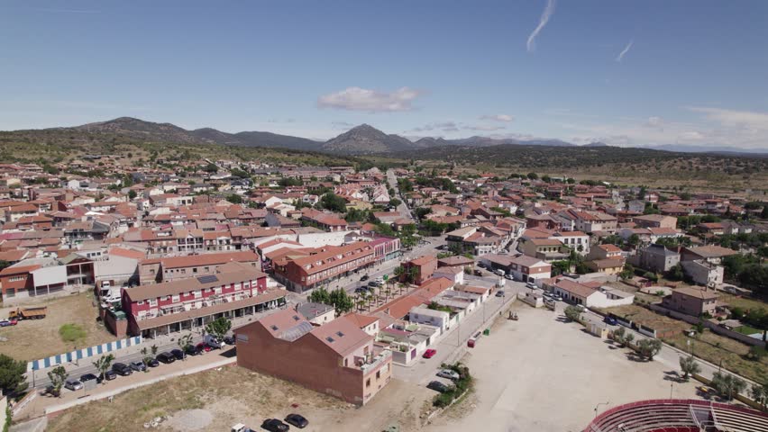 Aerial view flying across Navas del Rey neighbourhood municipality of the Community of Madrid, Spain