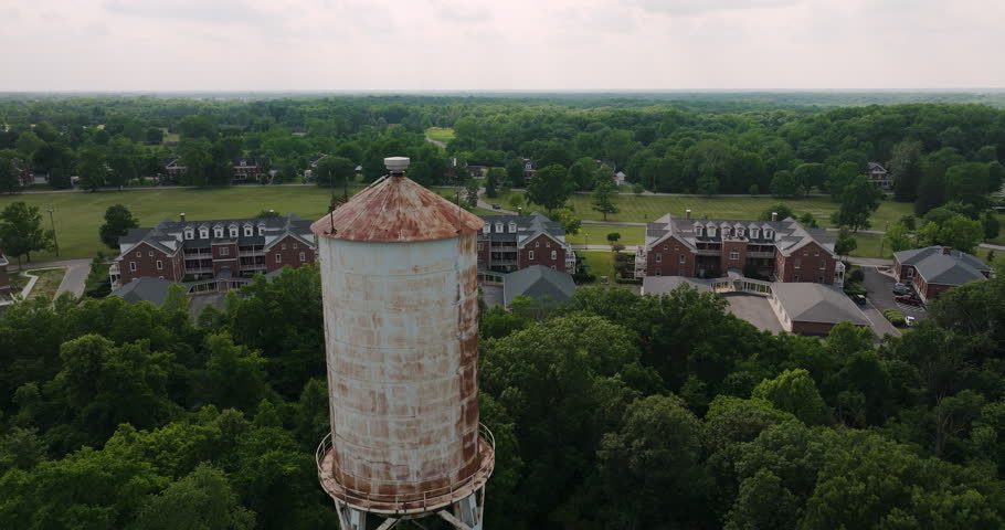 Close up aerial shot of old water tower high structure in Lawrence, Indiana