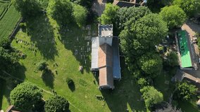 A bird's-eye-pan over St Andrew's church and graveyard in Wickhambreaux.
