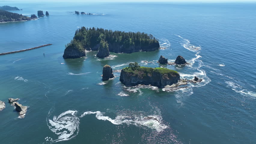 Rugged sea stacks are found off of the scenic Rialto Beach in Olympic National Park, Washington. This area is found at the mouth of the Quillayute River along the west coast of the Olympic peninsula.
