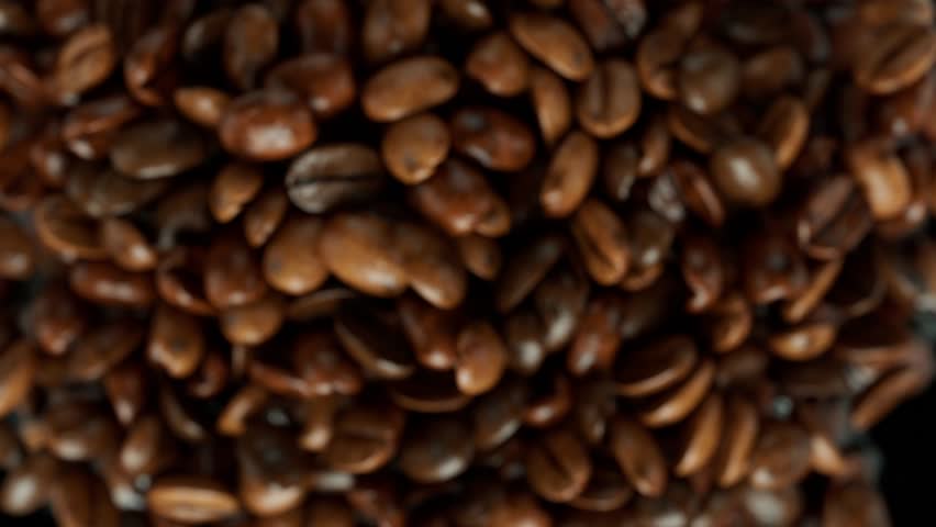 Super slow motion coffee beans jumping towards camera Royalty-Free Stock Footage #1106851871