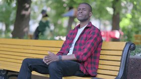 Waiting African American Man Checking Time on Watch while Sittting on Bench - Powered by Shutterstock - Get 15% off with code: PIKWIZARD15