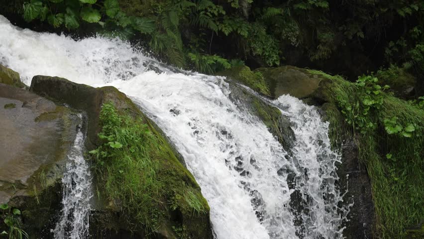 Spectacular Waterfall in the forest, Ukraine, Carpathians | Shutterstock HD Video #1106864741