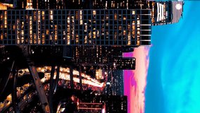 Epic Los Angeles downtown view on pink cinematic sunset. Aerial vertical, vertical video background.