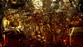 Super Slow Motion Shot of Pouring Cola Lemonade on Ice Cubes at 1000fps. - Powered by Shutterstock - Get 15% off with code: PIKWIZARD15