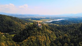 Stunning 4K drone footage of a castle Žovnek located northeast pf Braslovče, Slovenia. It lies above lake Žovnek. Video was shot during the summer time.
