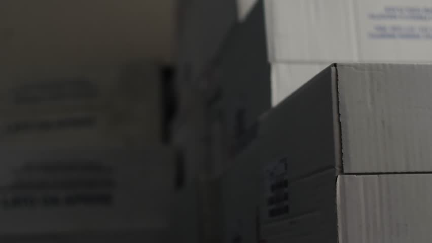 Unrecognizable worker loading cardboard boxes in a warehouse, orders, purchases, e-commerce products Royalty-Free Stock Footage #1106867819