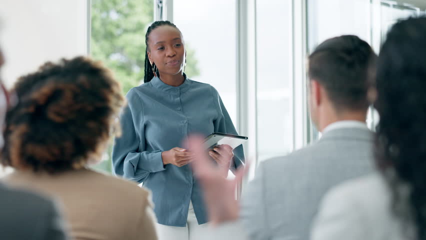 Business, training and black woman with tablet at seminar, brainstorming and mentor coaching in office. Workshop, teaching and motivation, leader and team in meeting for strategy, planning and staff. Royalty-Free Stock Footage #1106870463