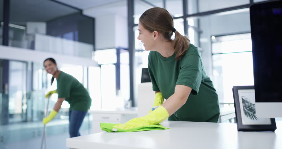 Office building, cleaner or happy woman cleaning as a team to wipe a dusty, dirty or messy table together. Cleaners, service or employees with smile working or washing bacteria off desk or furniture Royalty-Free Stock Footage #1106871005