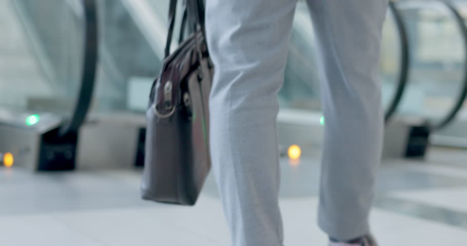 Businessman, walking and escalator in office lobby or entrance to building of work, business and corporate convention. Moving, stairs and man travel with bag for laptop or briefcase in airport Royalty-Free Stock Footage #1106871213