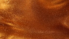Natural Golden sand in fluid. Abstract magic glittering background. Swirling waves of gold dust particles in liquid.  - Powered by Shutterstock - Get 15% off with code: PIKWIZARD15