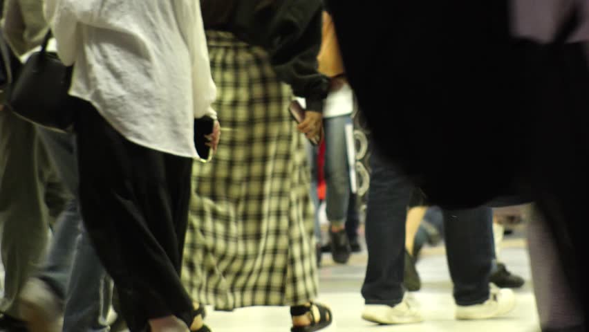 SHIBUYA, TOKYO, JAPAN : Time lapse shot of crowd of people walking at Shibuya station at night. Busy crowded downtown area in Tokyo. Japanese people and urban city nightlife concept 4K video.