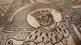 Old yellowed antique book, medieval king picture view. Rare timeless literature. Treasures of past. Museum piece from library.  - Powered by Shutterstock - Get 15% off with code: PIKWIZARD15