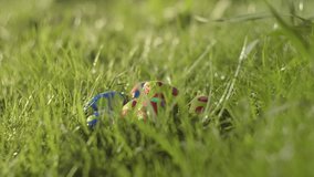 Painted Easter Eggs Hidden On Vibrant Spring Grass. Selective Focus Shot - Powered by Shutterstock - Get 15% off with code: PIKWIZARD15