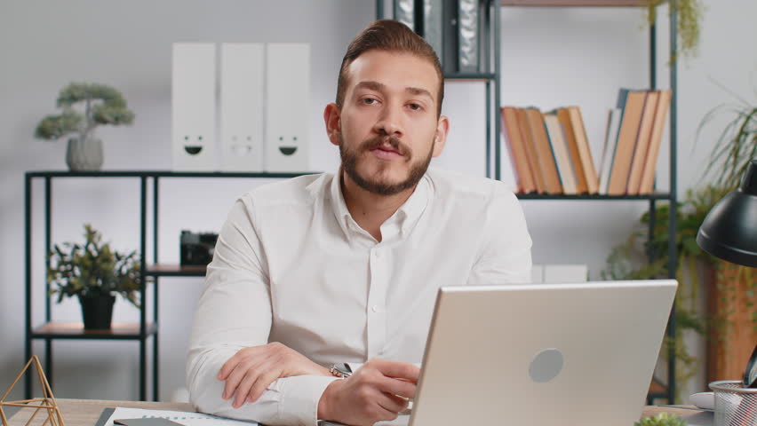 Business man show plastic credit bank card advertising transferring money cashless, purchases online shopping, sale discount, internet order delivery, booking. Freelancer guy talking looking at camera