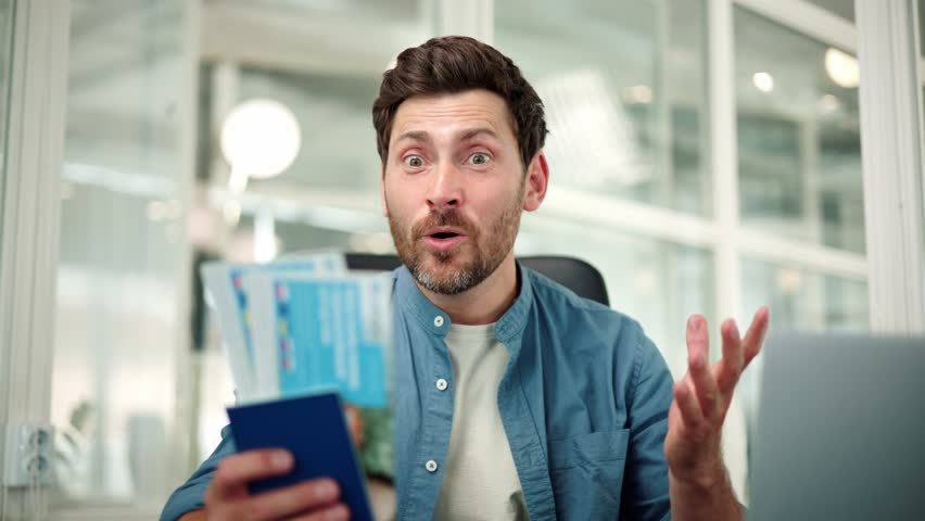 Euphoric excited office worker holds a passport with vacation tickets, looks into the camera and enthusiastically shouts wow, last day of work in the office before going on vacation with their family. Royalty-Free Stock Footage #1106898167