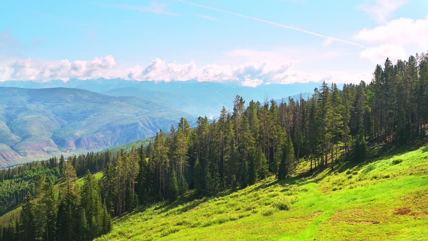 Beaver Creek ski resort with riding ski lift cable car in summer at Gore range view on mountains ridge peaks pov point of view shot