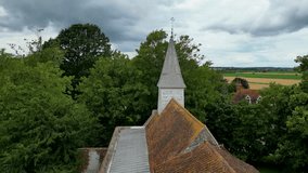 An arc shot of the steeple of All Saints church in West Stourmouth.