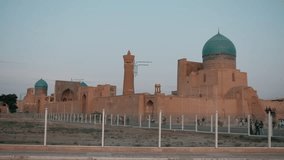 Bukhara, Uzbekistan view of Kalan Minaret Emir and Alim Khan madrasah of Po-i-Kalan, islamic religious complex. Popular travel destination in Asia.