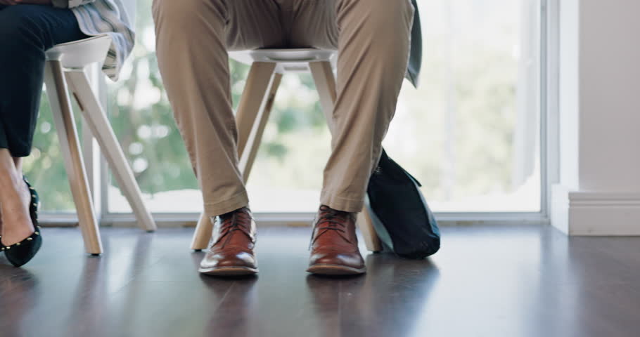 Job interview, row and feet of business people in waiting line for recruitment offer at HR office. We are hiring, lobby and legs of candidates in a queue for meeting, onboarding or company startup