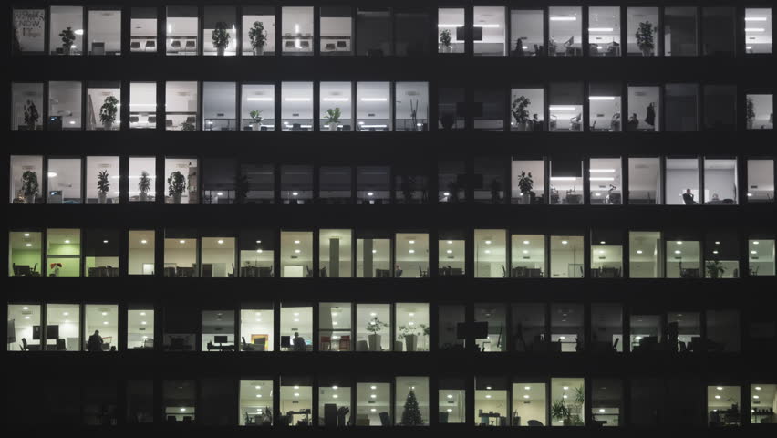 Lights switched off in the building's offices at the end of the working hours, timelapse Royalty-Free Stock Footage #1106907983