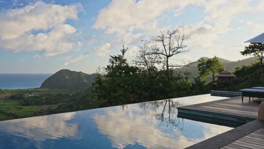 Luxury architecturally designed infinity pool on the edge of wooden balcony in Lombok, Indonesia