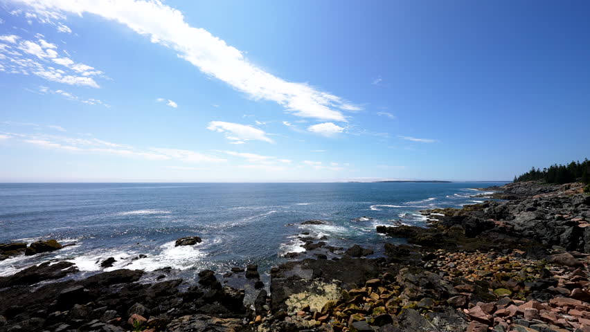 wide shot of Atlantic coast waves crashing onto the Maine Acadia Park rocky coastline with sound audio